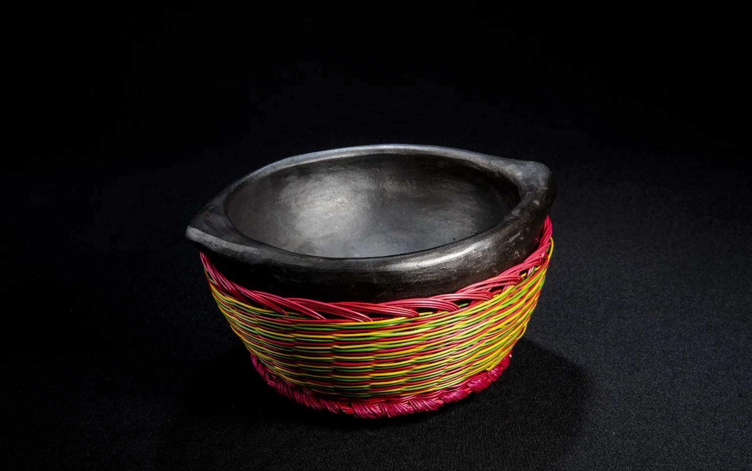 Colombian clay bowl with woven fiber